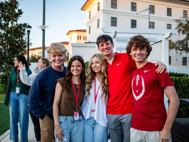 Florida College students together on campus at sunset